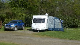 caravan and blue family car