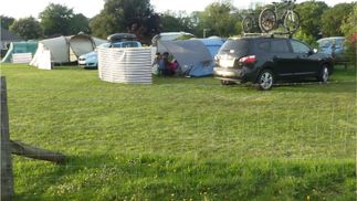 campsite and car park next to tents